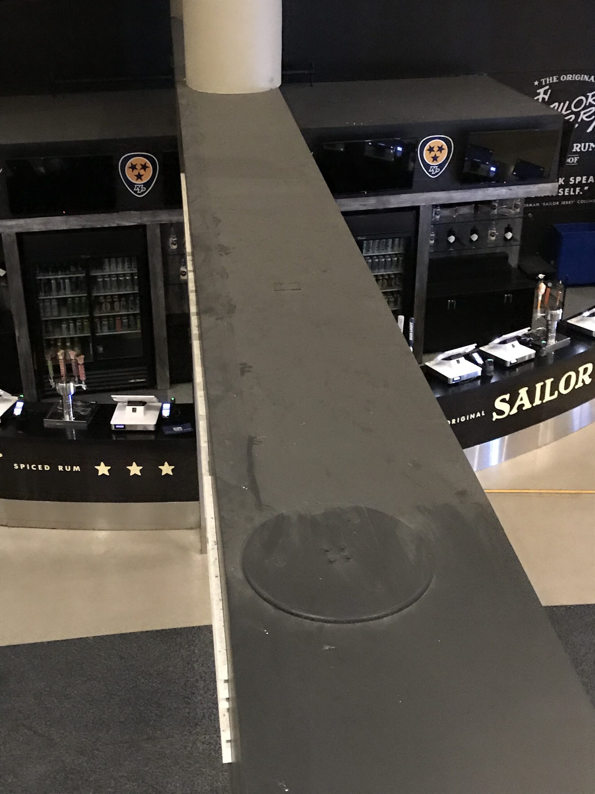 A dusty metal beam with a bar in the middle before cleaning. DPM Surface Care