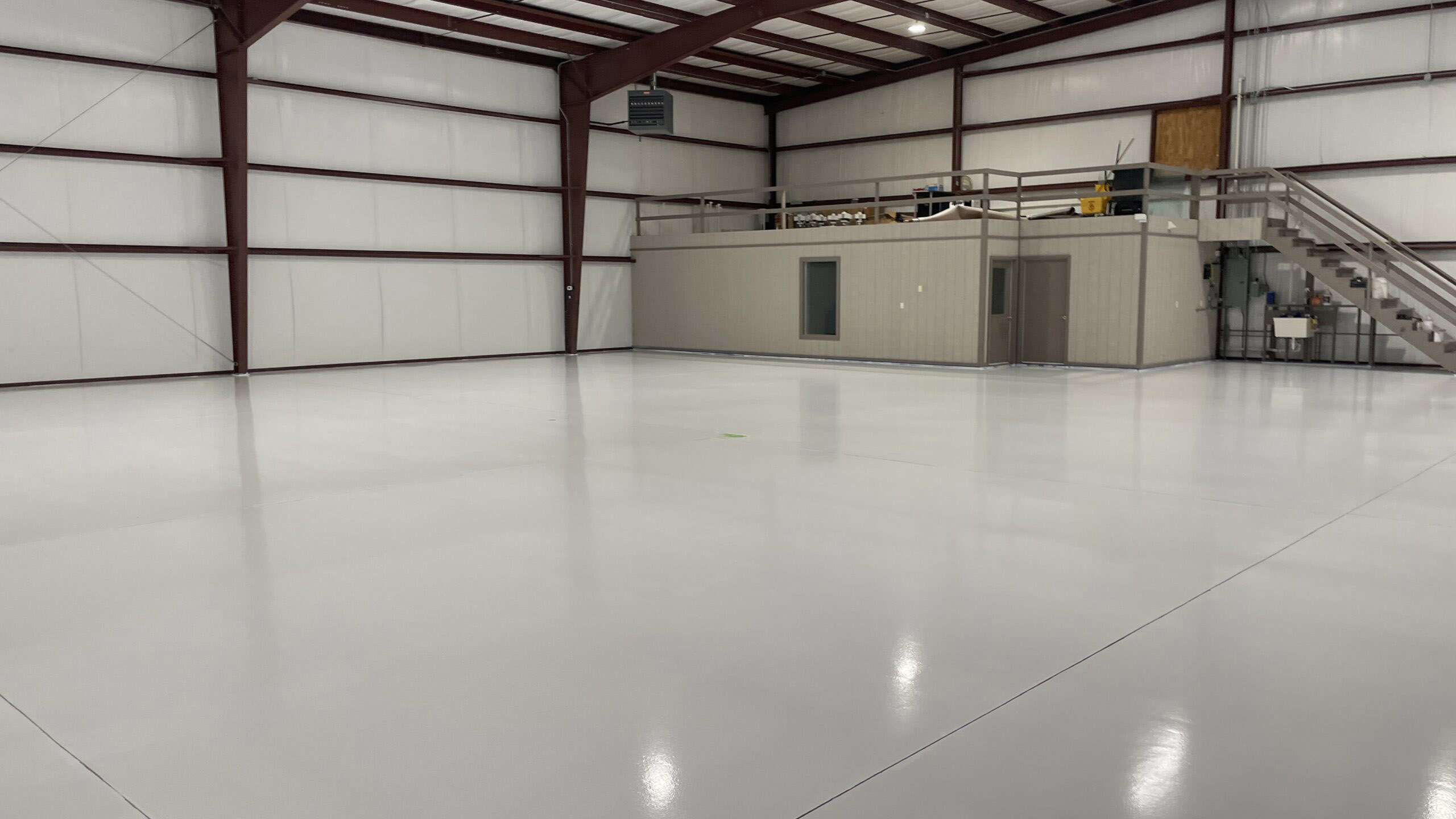 IMG_2865-1-scaled A spacious room with an epoxy coating floor, and a loft. DPM Surface Care
