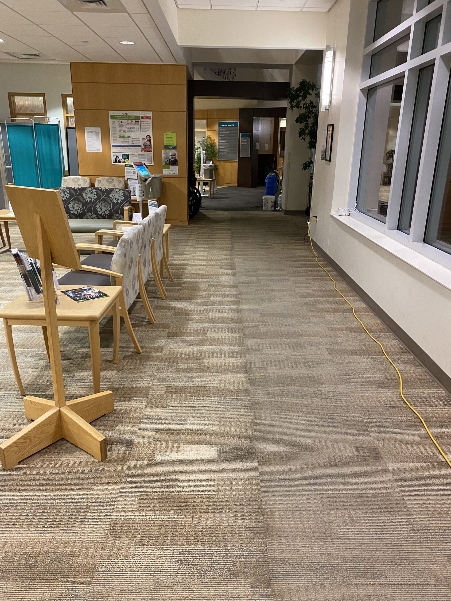 A hallway with carpet in a commercial office. DPM Surface Care