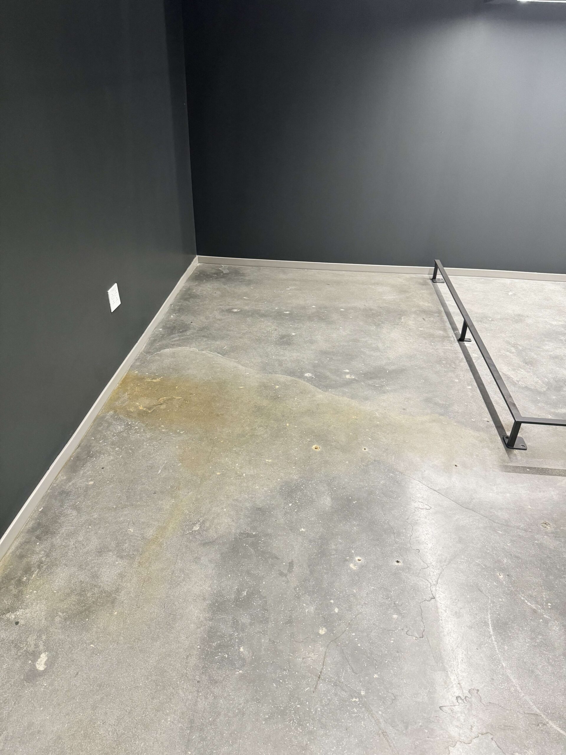 concrete – before A concrete floor with a huge water stain, before cleaning. DPM Surface Care